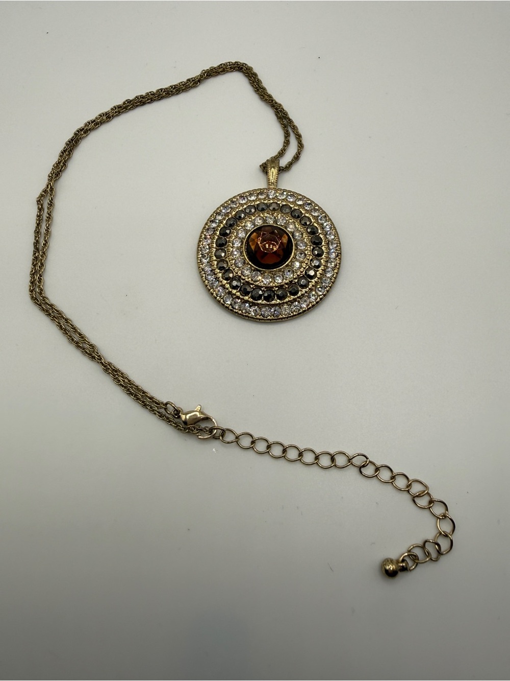 Gold-Tone Round Pendant Necklace with Amber Center and Clear Accents